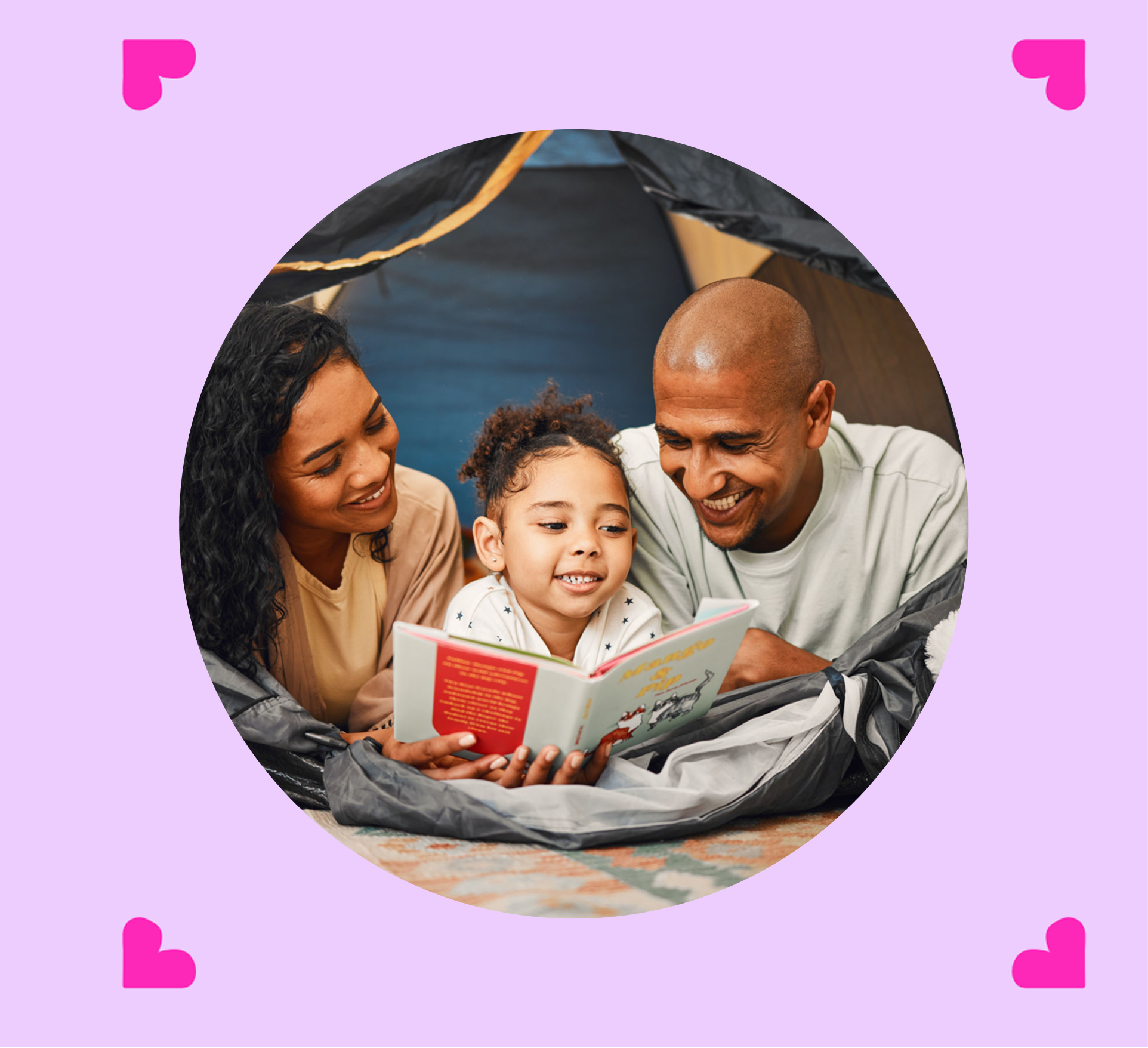 Family reading together inside a tent.